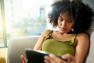 Buy stock photo Relax, tablet and reading with woman on sofa for social media, streaming service and connection. Movie showtimes, subscription and film schedule with person in living room of home for web search