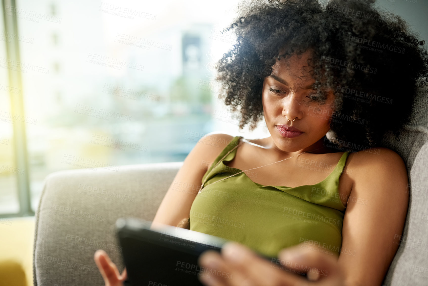 Buy stock photo Relax, tablet and reading with woman on sofa for social media, streaming service and connection. Movie showtimes, subscription and film schedule with person in living room of home for web search