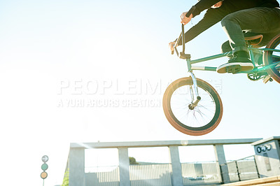 Buy stock photo Bike, air and person with jump in city with space, trick or stunt for extreme sports outdoor. Skill, action and below athlete on bicycle for fitness, urban cyclist challenge or rider with talent