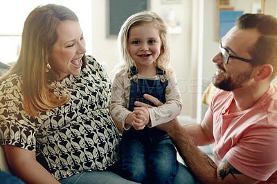 Buy stock photo Smile, parents and relax with kid at house for love, trust and bonding together with support. Portrait, pregnant woman and dad with child for security, care and family connection of affection on sofa
