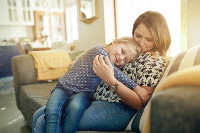 Buy stock photo Smile, mother and hug kid at house for love, trust and bonding together with parent safety. Happy, woman and embrace child on sofa for security, care and family connection with affection in lounge