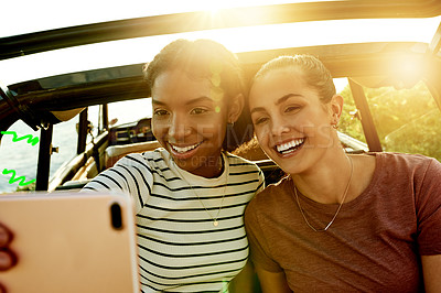 Buy stock photo Selfie, smile and car with women on road trip together for holiday, travel or vacation. Photograph, nature and social media with happy friends outdoor for profile picture with flare and destination