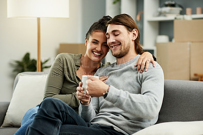 Buy stock photo Coffee, funny and relax with coupe on sofa in living room of new home together for investment. Boxes, drink and moving day with people laughing in apartment for finance, growth or property mortgage