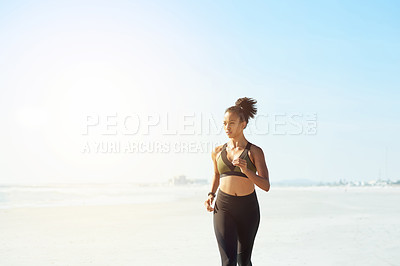 Buy stock photo Athlete, woman and running for fitness on beach for exercise, training and endurance routine. Space, female person and jog with blue sky, sports workout and marathon practice by ocean for wellness