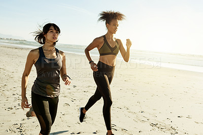 Buy stock photo Women, friends and running at beach for exercise, cardio challenge and outdoor by ocean in summer. People, girl and partner with space for fitness, workout and training routine by sea for wellness