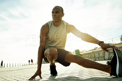 Buy stock photo Man, below and stretching legs for exercise, warm up and promenade for cardio preparation. Male person, urban street and athlete for workout, getting ready or fitness for marathon training with flare