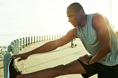 Buy stock photo Fitness, black man and stretching legs at beach to start running, exercise and cardio in morning. Active, athlete and wellness warm up on promenade for training preparation, getting ready and workout