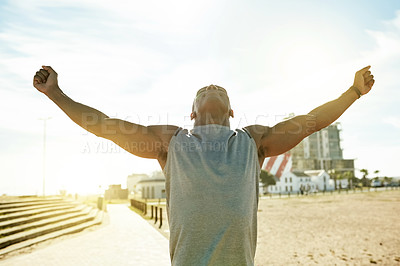 Buy stock photo Fitness, celebration and man with hands raised in city for running success, workout goals or progress. Morning, mockup space or runner with open arms outdoor for marathon achievement or cardio target