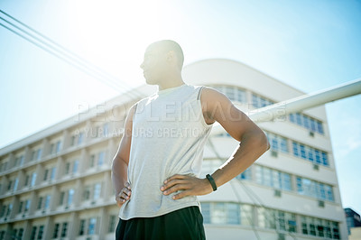 Buy stock photo Runner, fitness and thinking with man in city for cardio challenge, marathon practice and sports athlete. Workout, training and wellness with low angle of person on bridge for vision and reflection