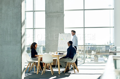 Buy stock photo Meeting, whiteboard and man with business people in office for strategy, finance review and planning. Corporate, team and workers in presentation for financial growth, feedback and proposal ideas