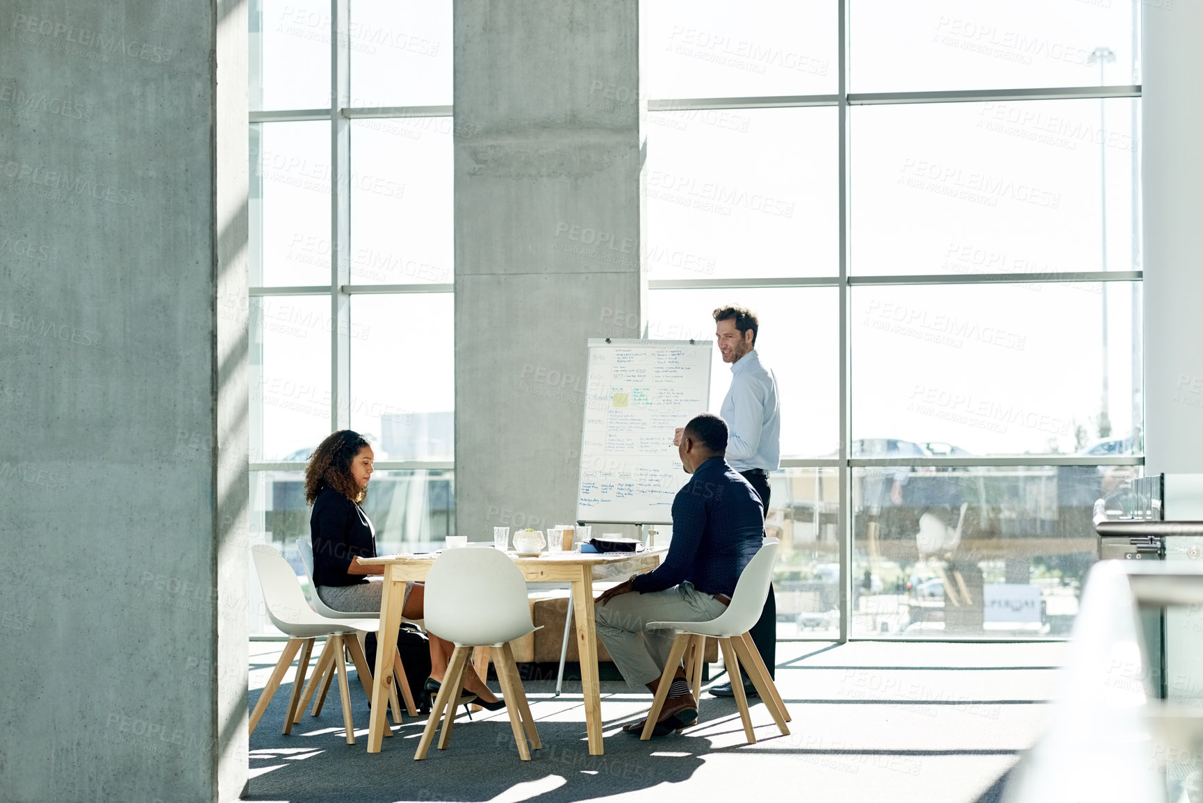 Buy stock photo Meeting, whiteboard and man with business people in office for strategy, finance review and planning. Corporate, team and workers in presentation for financial growth, feedback and proposal ideas