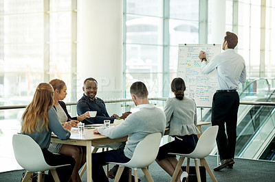 Buy stock photo Business, presentation and man in office, team and brainstorming with investment deal. Finance agency, people or speaker in workplace, discussion or feedback for profit growth, cooperation or meeting