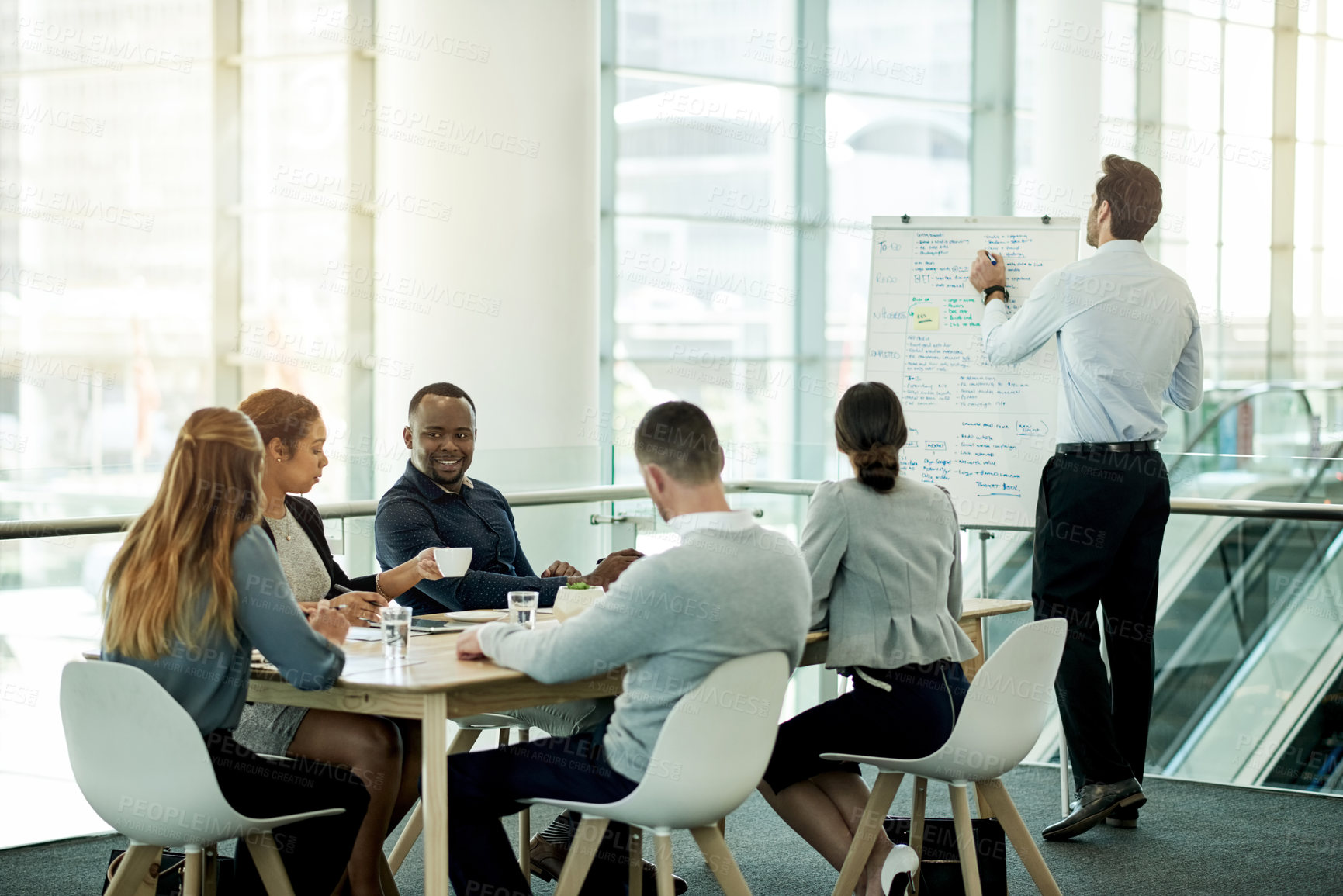 Buy stock photo Business, presentation and man in office, team and brainstorming with investment deal. Finance agency, people or speaker in workplace, discussion or feedback for profit growth, cooperation or meeting
