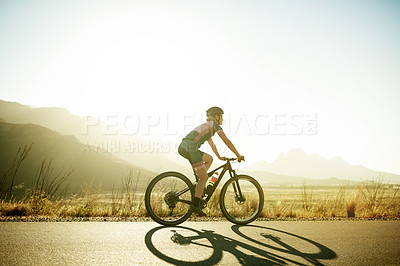 Buy stock photo Woman, bicycle and exercise with cycling outdoor, fitness and training for triathlon in nature. Person, cyclist or athlete with bike for ride in countryside, practice or prepare for health space