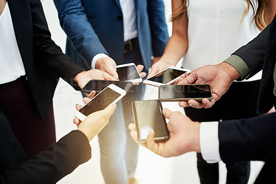 Buy stock photo Business people, hands and phone screen with connection for data sync, sharing app or online platform. Group, employees or circle with mobile in huddle for social media, connectivity or network
