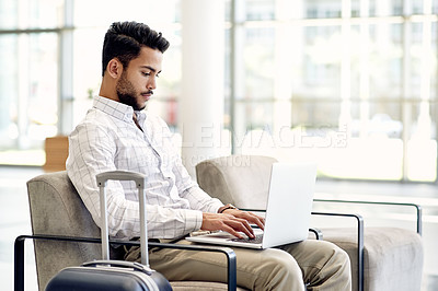 Buy stock photo Laptop, typing and business man in airport lobby for conference, travel and email confirmation. Online booking, seminar schedule and flight with person, luggage and tech for reservation information
