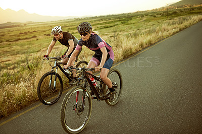 Buy stock photo Cycling, active and couple with bicycle, nature or ride for wellness, fitness and helmet for safety. Healthy, athlete and people with eco friendly transport, travel and exercise with bike outdoor