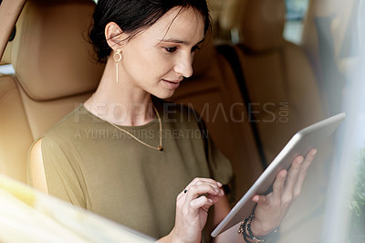 Buy stock photo Tablet, window and businesswoman in car with communication, networking or email online. Reading, digital technology and female corporate employee with contact on app in vehicle for transport.