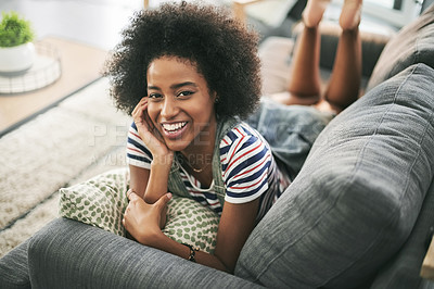 Buy stock photo Portrait, relax and woman laugh on couch in home for staycation, break or humor in apartment. African girl, smile and chill on sofa for comfort, funny and resting in living room with happiness
