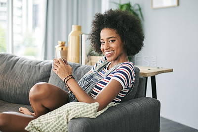 Buy stock photo Phone, portrait and smile with woman on sofa in living room of home for social media browsing. App, communication and text message with happy African person in apartment for break on weekend