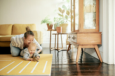 Buy stock photo Newborn, toy and mother playing with baby on the floor of a house or home and bonding together. Care, motherhood and single parent or woman having fun and laughing with infant or kid with happiness