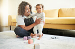 Smile, family and mother play with baby in living room with building blocks, toys and relax together on floor. Love, child development and happy mom and kid for bonding, quality time and playing game