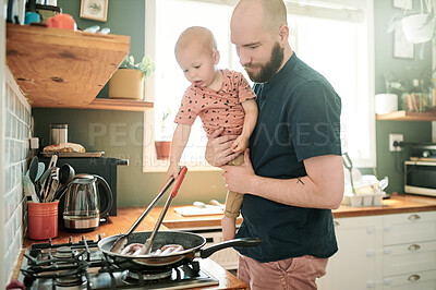 Buy stock photo Cooking, kitchen and a man at home with his baby in the morning together for food or lunch preparation. Family, children or kids with a father and infant boy in a house to make a meal while bonding
