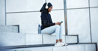 Buy stock photo Fitness, headphones or happy woman with music on staircase for outdoor workout break or rest. Muslim, female person or listening with phone for mobile entertainment, online podcast or audio streaming
