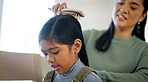 Kid, happy mother and brush for hair care in home, grooming and help daughter in morning routine. Parent, girl and hairstyle assistance with Asian family, beauty support o bonding together with love