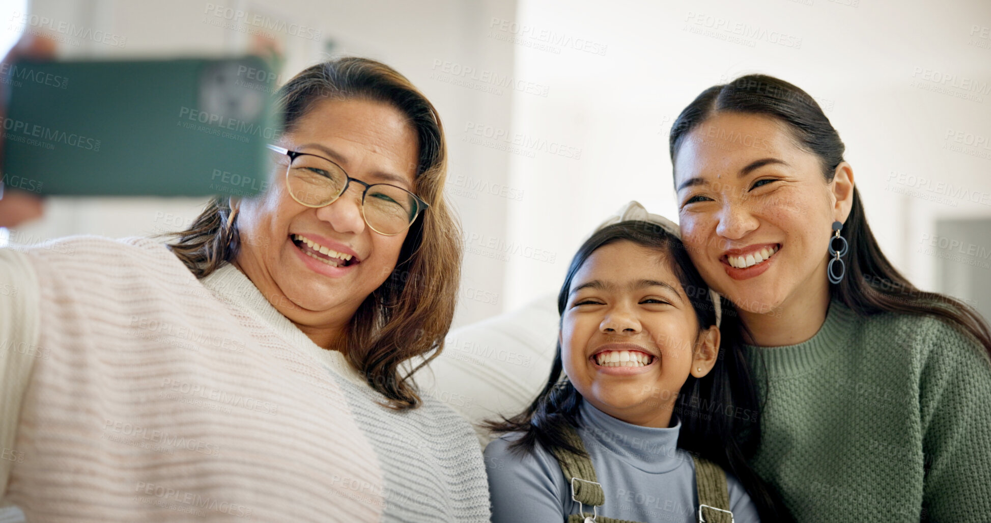 Buy stock photo Family, selfie and child with grandma in lounge, connection and laughing with senior mother in home. Mom, generations and Asian people with girl, happy and profile picture with grandparent in house
