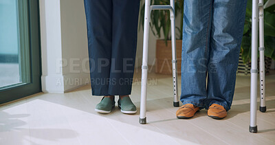Buy stock photo Legs, people and helping with walker for physio, balance and mobility support for rehabilitation. Feet, physiotherapist and patient with disability for checkup, stability aid and physiotherapy guide