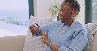 Buy stock photo Senior, woman and happy in home with smart watch, monitor health vitals or medication reminder. Pensioner, black person and smile with wristwatch, heart rate and daily wellness summary in retirement