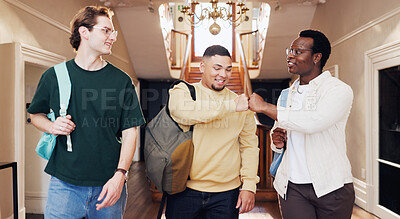 Buy stock photo Friends, walk and fist bump in university for greeting, conversation or learning together for degree. Happy, men and respect gesture in college with education, community and meeting people on campus.