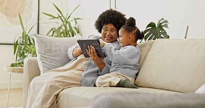 Buy stock photo Grandma, scroll and child with tablet in home, laughing and watching cartoons with subscription. Family, online and senior black woman with daughter, happy and streaming movie with tech in house