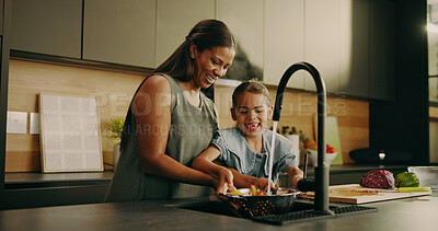 Buy stock photo Mother, child and cleaning vegetables in home, teaching and learning domestic duties and parenting. Happy woman, daughter and wash produce for cooking, guide and helping hand with chores for hygiene