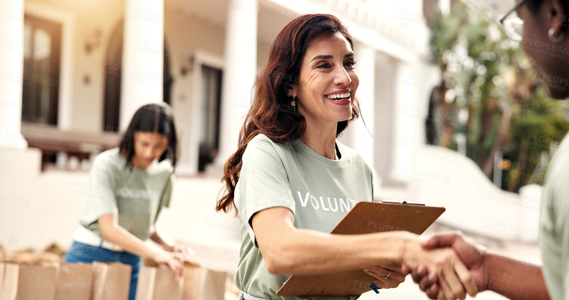 Buy stock photo Donation, volunteer or happy woman with handshake for charity, checklist or fundraiser campaign. Female person, activist or shaking hands with smile for community service or outdoor outreach together