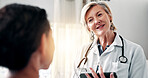 Doctor, woman and discussion in office with patient, medical checkup and smile for recovery feedback. Happy, healthcare worker and mature person talk in clinic with consultation, healing or wellness.