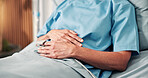 Woman, hands and sick in hospital bed with stomach ache, endometriosis and cervical cancer symptoms. Person, abdominal pain and inflammation in clinic with ovarian cyst, PCOS and medical condition.