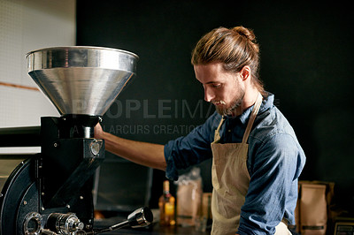 Buy stock photo Barista, equipment and ground coffee with man in factory for manufacturing of caffeine product. Business, cafe and preparation with person in kitchen or workshop for beverage, blend and brew