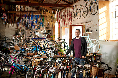 Buy stock photo Bicycle, business and portrait of man in store for fixing, repair and selling bike equipment. Startup, workshop and person with sustainable vehicle for maintenance, cyclist technician and mechanic
