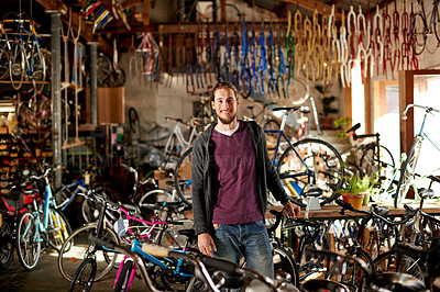 Buy stock photo Man, portrait and smile in bike repair shop for maintenance, confidence and garage. Bicycle, mechanic and service with a happy technician for startup, small business owner and workshop for fixing