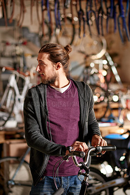 Buy stock photo Thinking, technician and man with bicycle, shop and repairing eco friendly transport or maintenance. Mechanic, restoration and person with ideas for service, garage or entrepreneur with bike in store