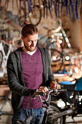 Buy stock photo Bicycle, repair and man in shop, entrepreneur and maintenance of eco friendly transport and service. Technician, inspection and person with bike, fixing or restoration in small business or garage