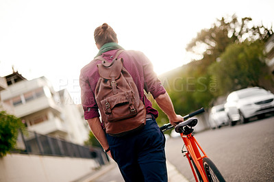 Buy stock photo Back, walk or man on bicycle in city for eco friendly transport, commute or entrepreneur. Outdoor travel, leaving or designer on road in urban town with ride, fashion or bike for creative job