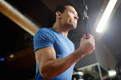 Buy stock photo Strong, exercise and machine with man in gym for cable pulley, fitness and muscle development. Workout equipment, athlete and training with intense person in sports club for bodybuilder reps