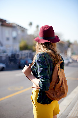 Buy stock photo Back, girl and waiting at bus stop in city for travel ideas, public transport and sightseeing abroad. Female teenager, sunbathing and tourist explore, morning commute and delayed taxi of getaway trip