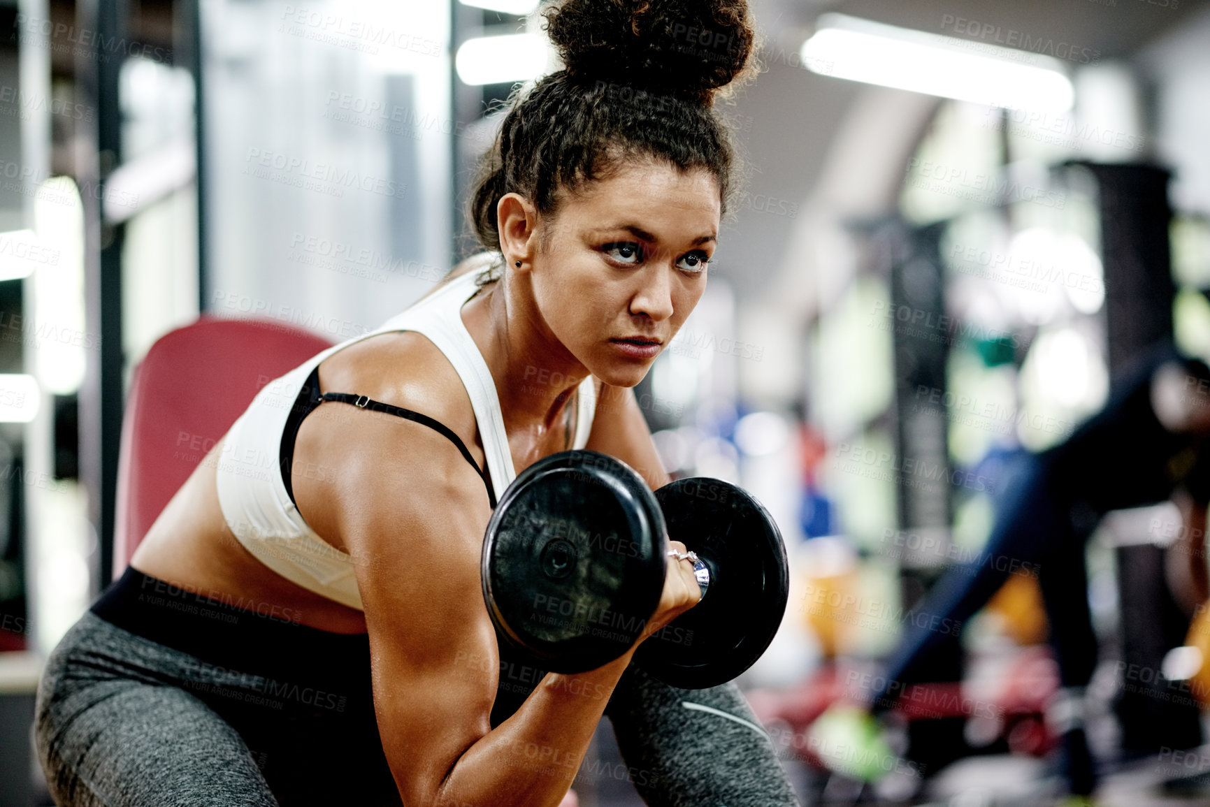 Buy stock photo Training, woman and dumbbell for bodybuilder, workout and fitness in gym for health and power. African person, weightlifting and commitment for muscle development, challenge or exercise for wellness