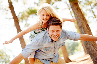 Buy stock photo Happy, father and child with piggyback in nature for airplane game, flying together and imagination. Family, single dad and carry girl on back at park for fantasy, freedom and bonding with portrait