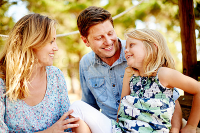 Buy stock photo Holiday, parents and girl in nature with smile, love and bonding together on weekend break. Happiness, support and family in forest, connection and outdoor on summer adventure to playground.