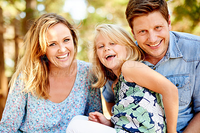 Buy stock photo Portrait, parents and girl in nature with smile, relax and bonding together on weekend break. Happiness, support and family in forest, holiday connection and outdoor adventure on summer vacation.